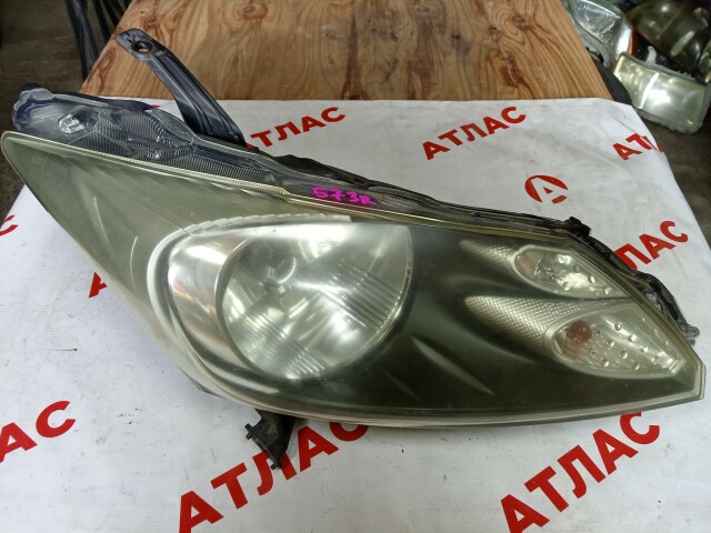 Фара HONDA Freed 